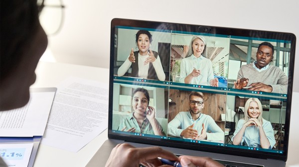Photo of a woman on her computer for a group video conference call