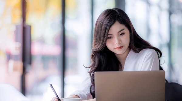 Photo of a woman working at her computer